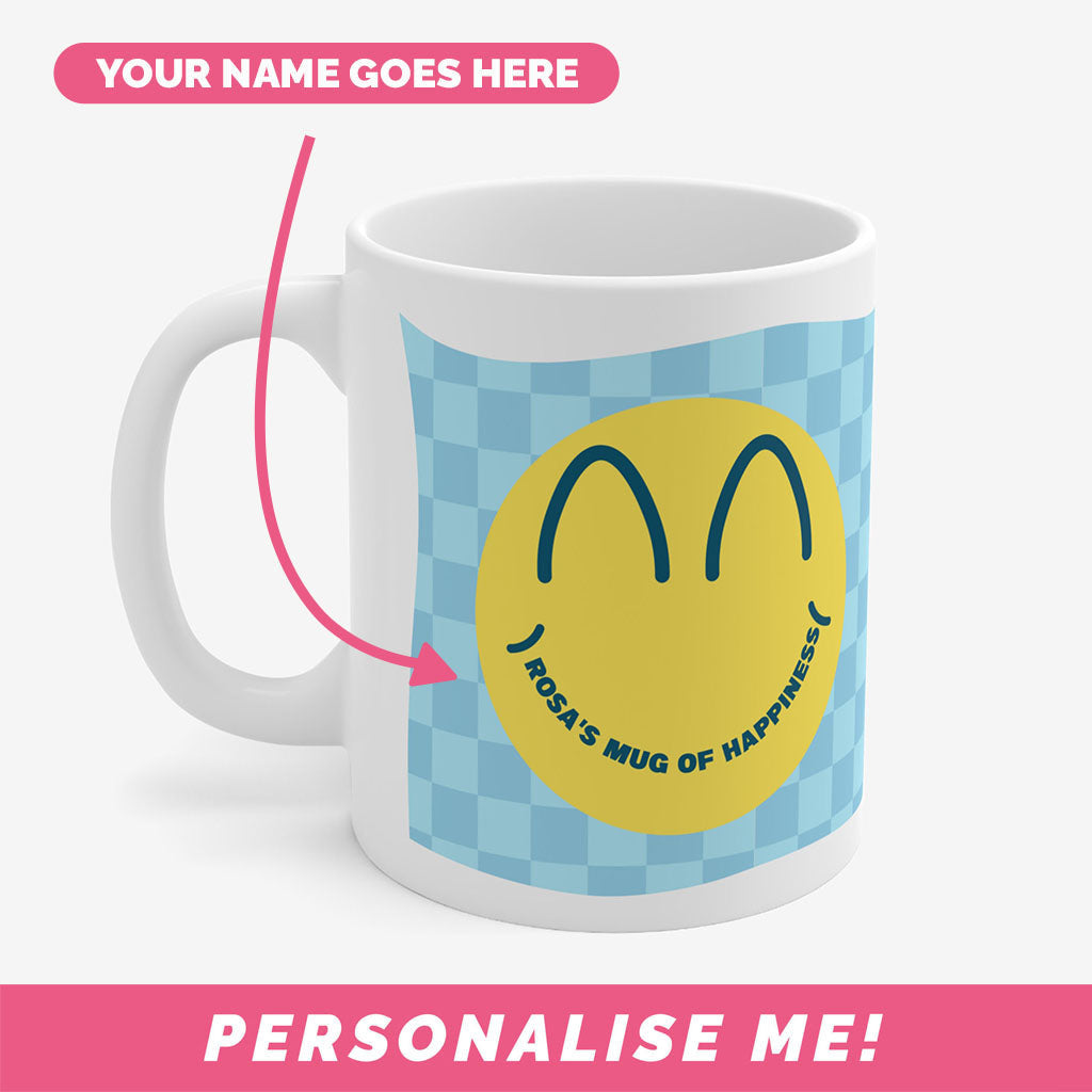 Ceramic mug with smiley face and personalised text.