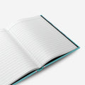 Custom hardcover notebook open showing lined pages.