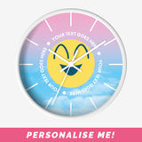 Modern wall clock with a pink and blue gradient background, smiley face motif and personalised text.